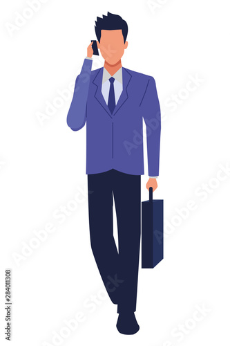 Executive businessman talking on phone and holding briefcase