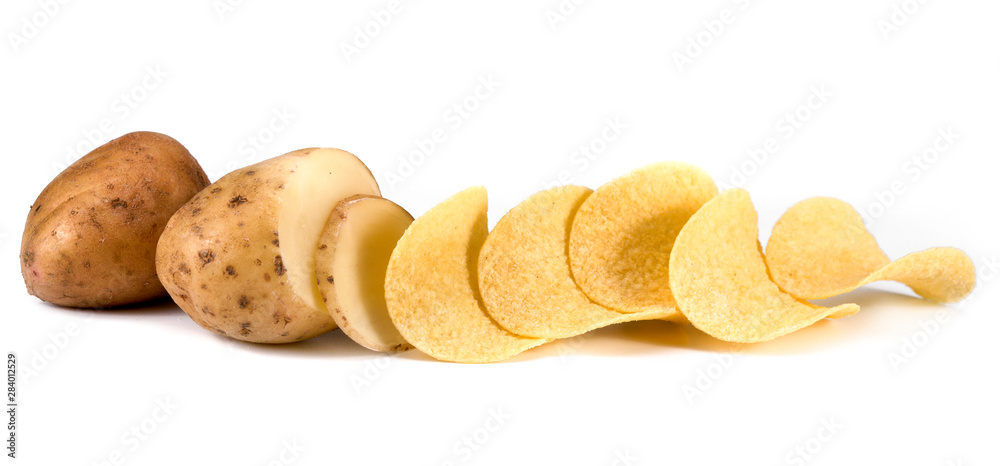 Potato chips and raw potatoes on a white background. A portion of potato chips and raw potatoes on a white background Potato chips and raw potatoes on a white background. A portion of potato chips and raw potatoes on a white background