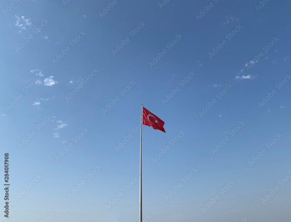 Turkish Flag Waves on Clear Sunny Partly Cloudy Weather Background