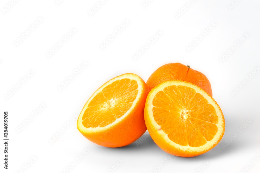 Orange fruit with slice isolated on white background.