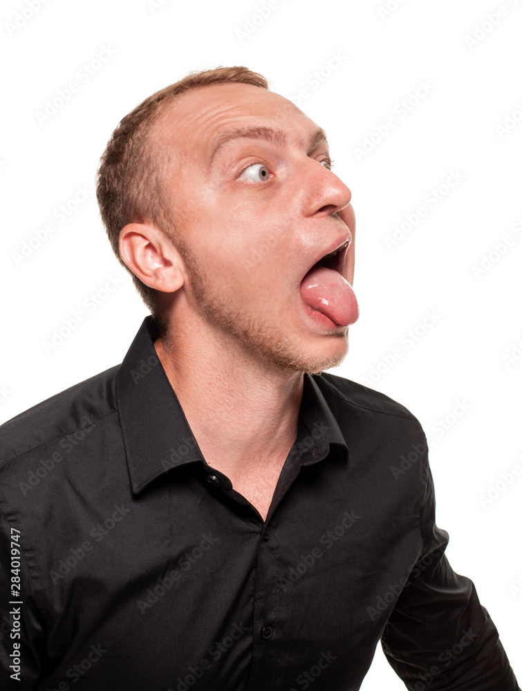 Fototapeta premium Handsome young blond man in a black shirt, isolated on a white background