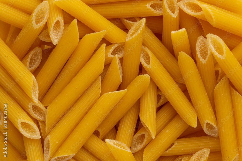 Background Italian pasta hard varieties, closeup. Culinary background, macro, horizontal frame Background Italian pasta hard varieties, closeup. Culinary background, macro, horizontal frame