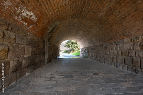 Long stone walled urban tunnel image