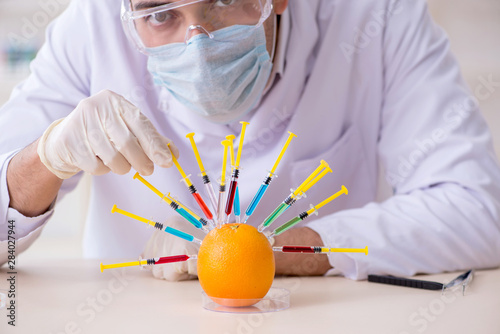 Male nutrition expert testing food products in lab