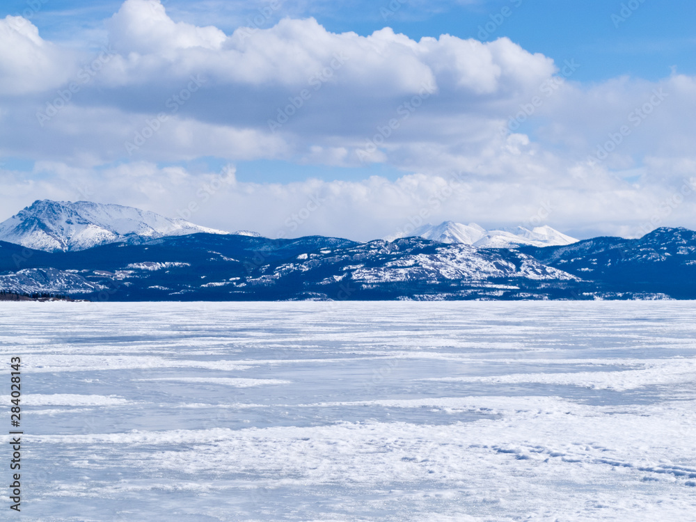 Frozen Lake Laberge winter landscape Yukon Canada
