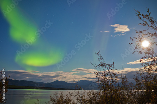 Aurora borealis full moon over Lake Laberge Yukon photo