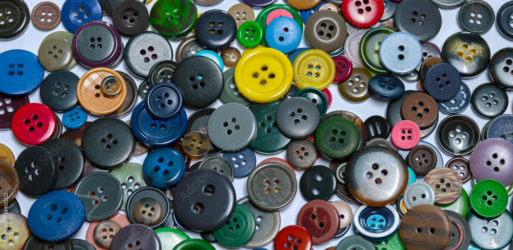 Background from multi-colored randomly scattered buttons. Background from multi-colored randomly scattered buttons.