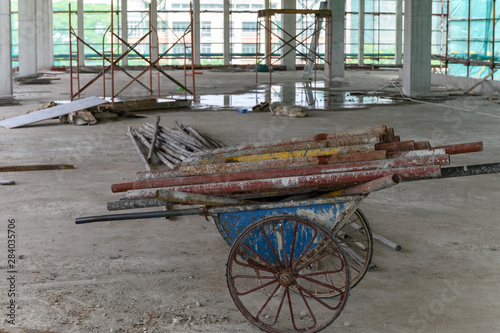 inside of an unfinshed building with protection scaffolding and netting surrounded photo