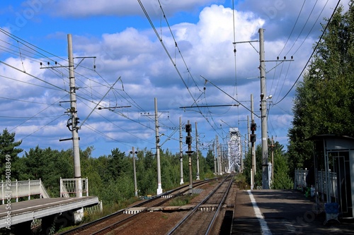 railway platform with electric wires and semaphores