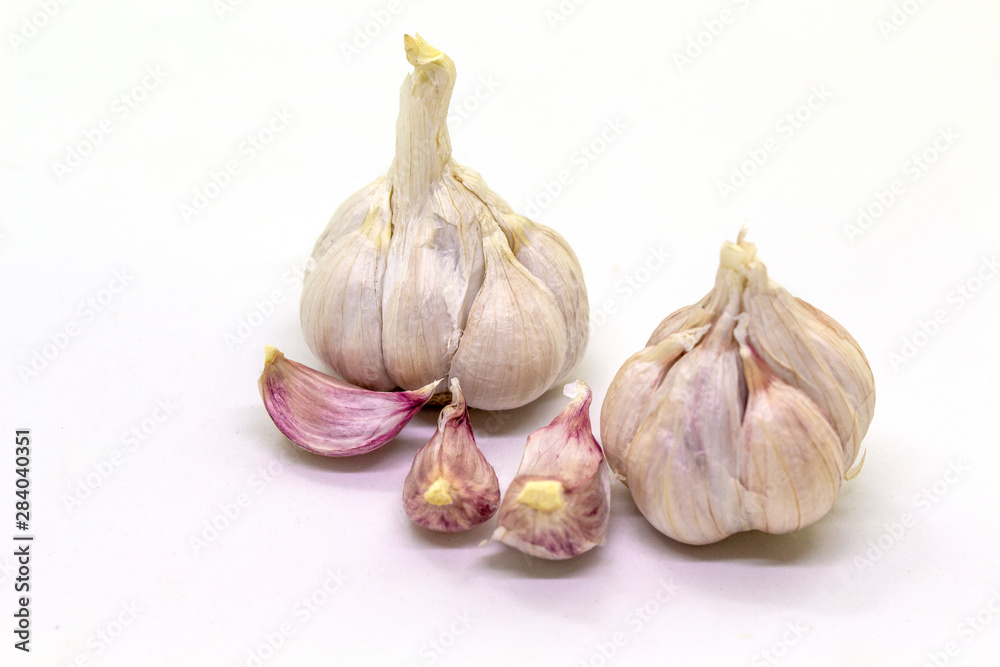 Obraz premium Garlic on a white background, used for cooking, universal food