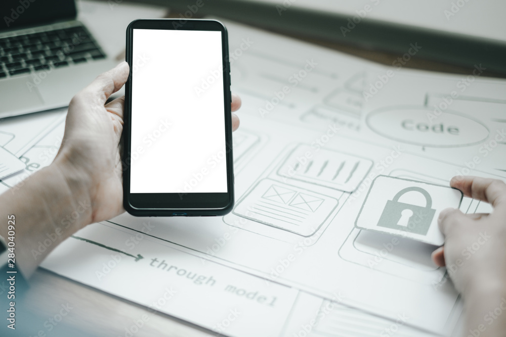 Mockup image of engineers using smartphone to drawing design building Project in office, mockup concept Mockup image of engineers using smartphone to drawing design building Project in office, mockup concept