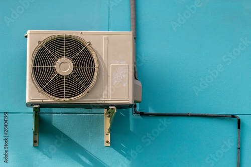 Hot air coil outside the house,Air conditioner on a blue background