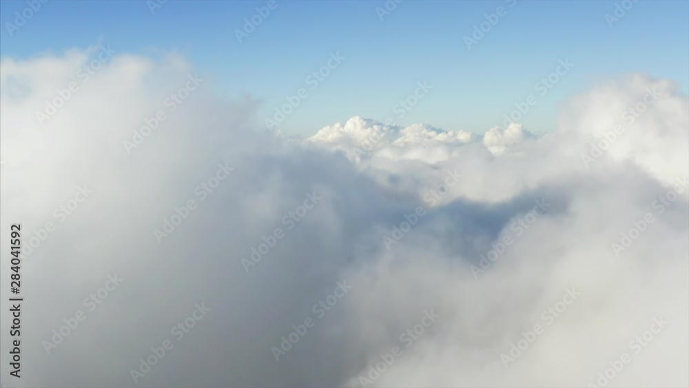 Flying above great fluffy clouds in the morning. Aerial Flying above great fluffy clouds in the morning. Aerial