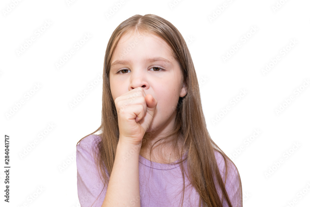 The little girl strongly coughs in a fist Is isolated on a white background. The little girl strongly coughs in a fist Is isolated on a white background.