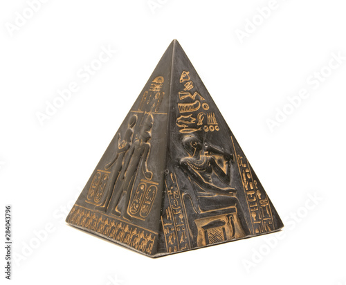 Obraz na plátně pyramid figurine stands on a white background