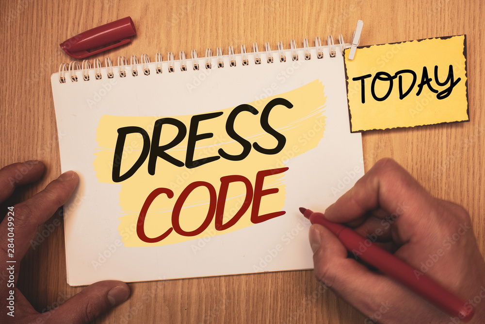 Text sign showing Dress Code. Conceptual photo Rules of what you can wear and not to school or an eventMan creating for today on notebook Hand hold holding pen Wooden background Text sign showing Dress Code. Conceptual photo Rules of what you can wear and not to school or an eventMan creating for today on notebook Hand hold holding pen Wooden background
