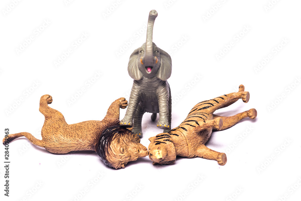 Elephant ,tiger and loin toys isolated on white background