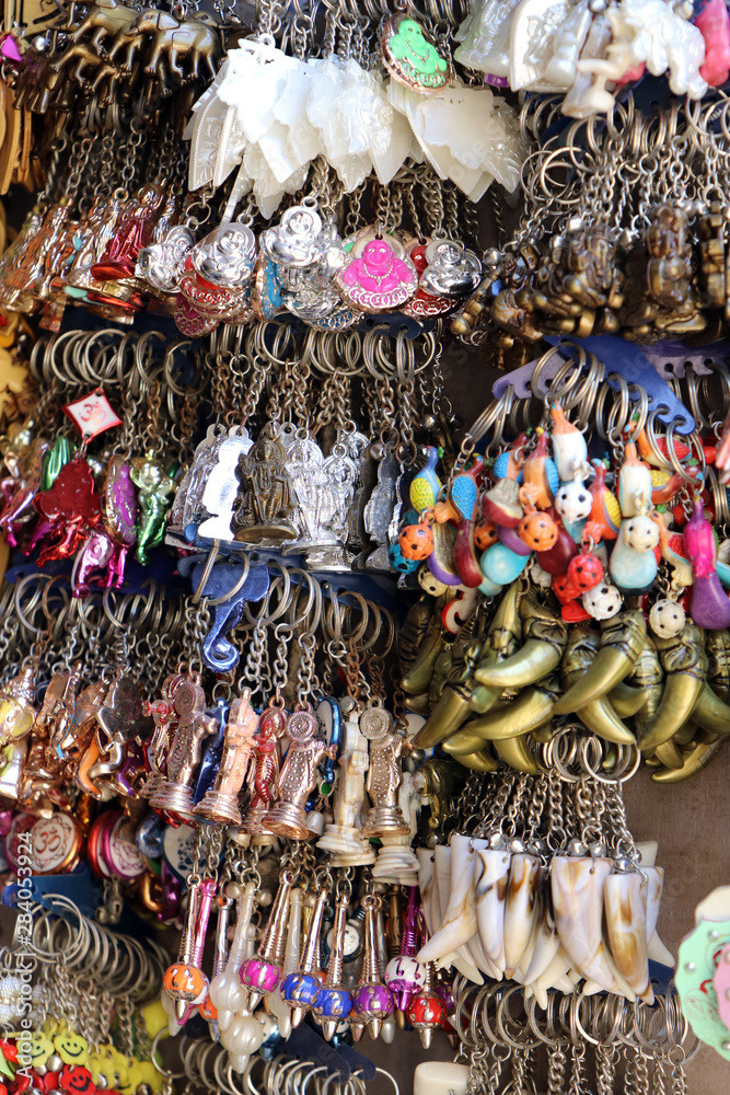 Keychains are hanging for sale in a shop