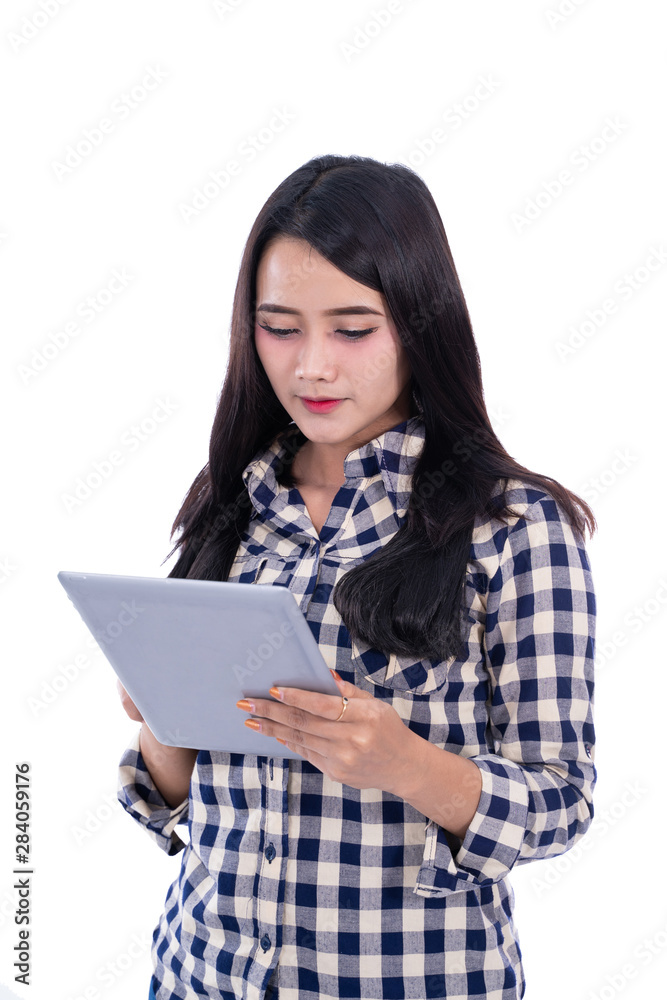 young woman student using tablet on isolated background young woman student using tablet on isolated background