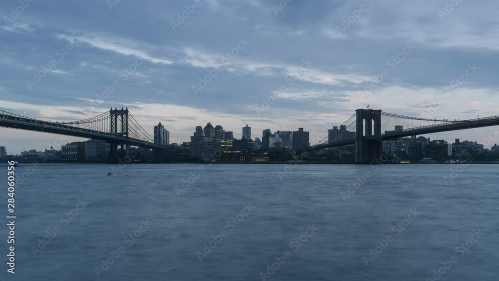 Day to night time-lapse during storm with Dumbo view from East river Day to night time-lapse during storm with Dumbo view from East river