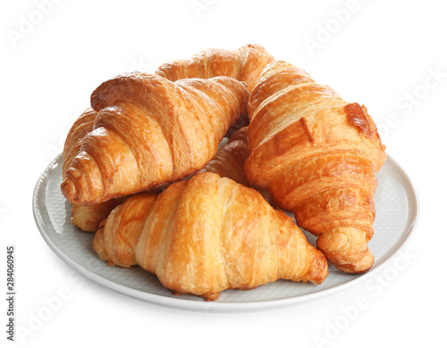 Plate with tasty croissants on white background. French pastry