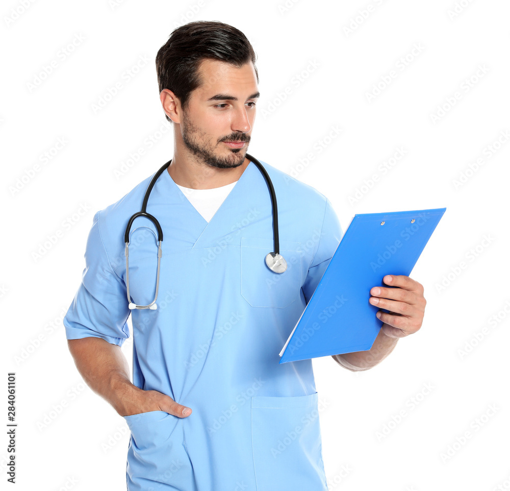 Young male doctor in uniform with stethoscope and clipboard on white background. Medical service Young male doctor in uniform with stethoscope and clipboard on white background. Medical service