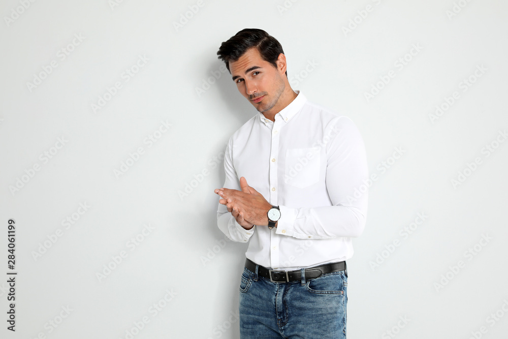 Portrait of handsome young man on light background Portrait of handsome young man on light background