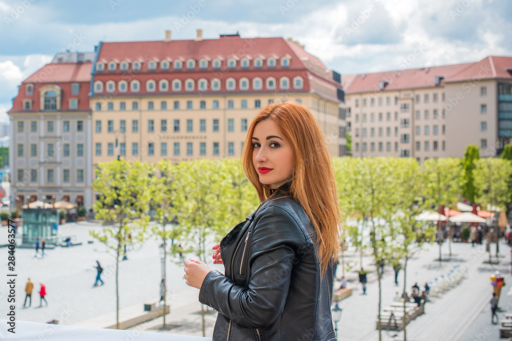Fototapeta premium Tourism and adventure concept, rest in Europe. Beautiful woman in Germany streets . Vacation in Dresden 