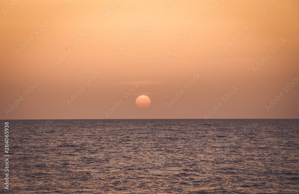 Sunset by the beach summer background