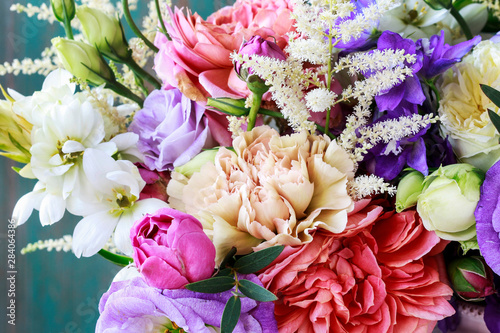 Fototapeta Naklejka Na Ścianę i Meble -  Flower background with rose, eustoma, carnation and spiraea.