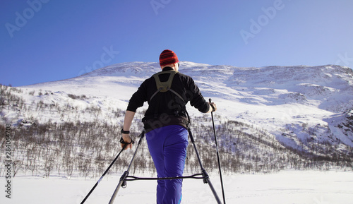 Cross country skier with pulka (sled) in national park Sarek, Swedish Lapland. Sweden.