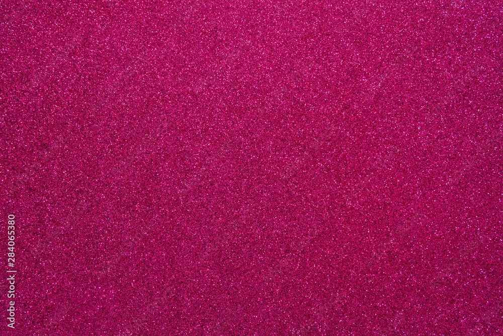 Fototapeta premium Magenta glitter. Abstract shiny background. Design paper texture for decoration and design of Christmas, New Year or other holiday pictures. Beautiful packaging material.