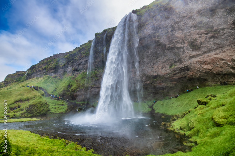 Fototapeta premium Seljalandsfoss, side view on a beautiful summer day in Iceland