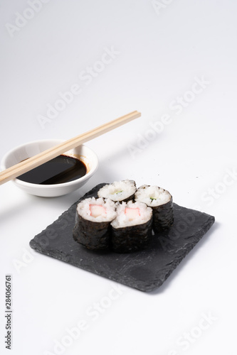Mix sushi set, Japanese food on slate platte isolated white background