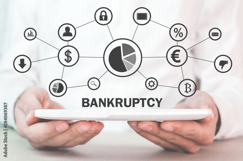 Man with a Bankruptcy text and financial network. Man with a Bankruptcy text and financial network.