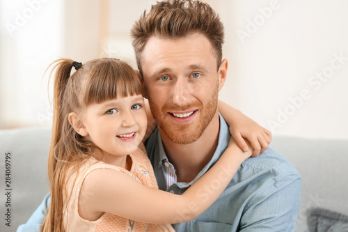 Portrait of happy father an...