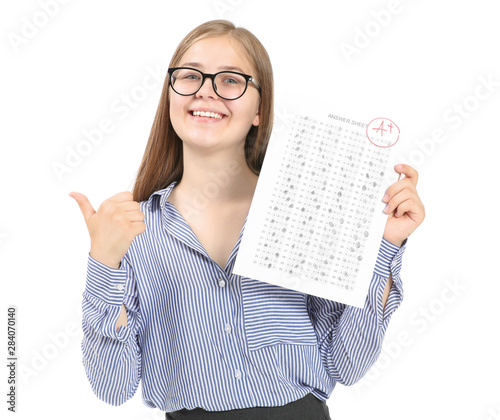 Happy girl with results of school test on white background photo