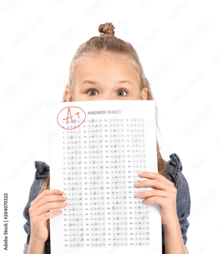 Naklejka premium Girl with answer sheet for school test on white background
