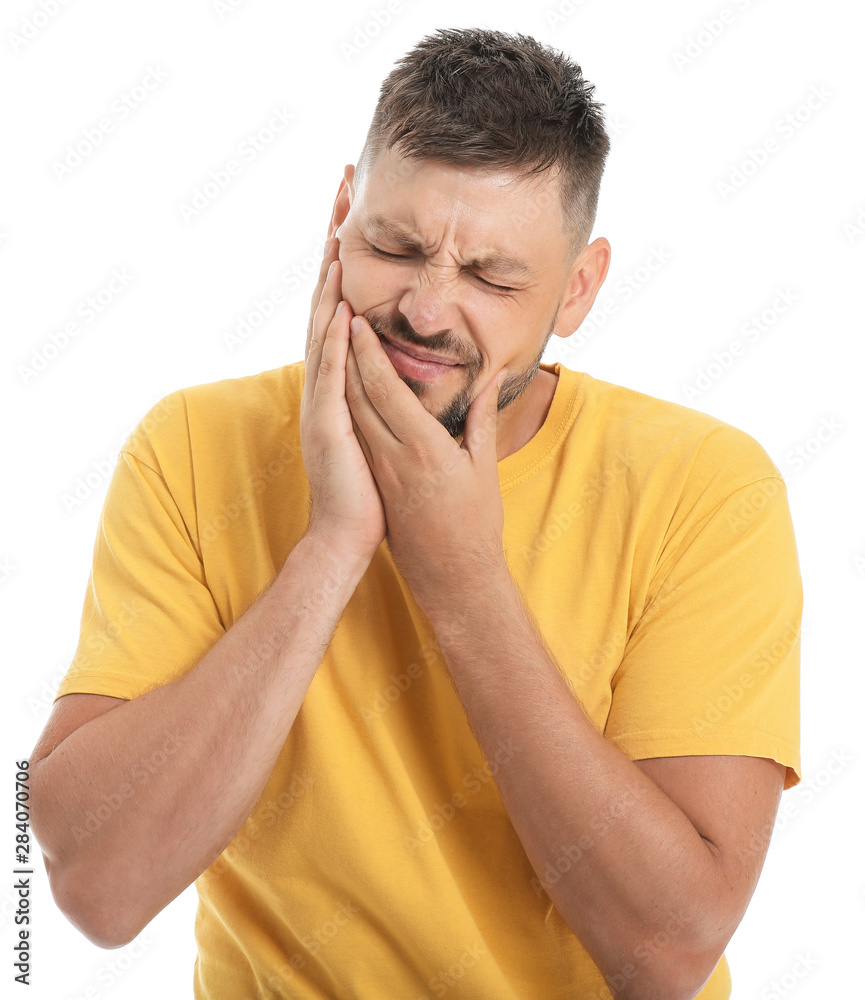 Man suffering from toothache against white background Man suffering from toothache against white background