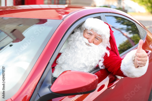 Santa Claus showing thumb-u...