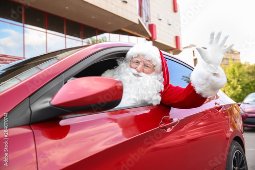 Santa Claus leaning out of ...