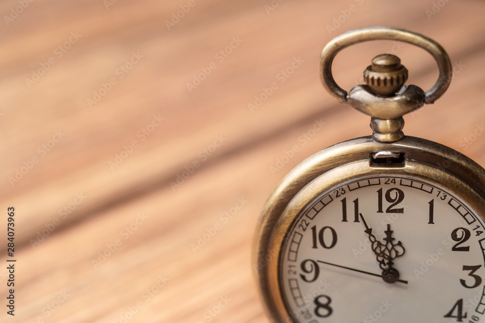 Old clock on a wooden background Old clock on a wooden background
