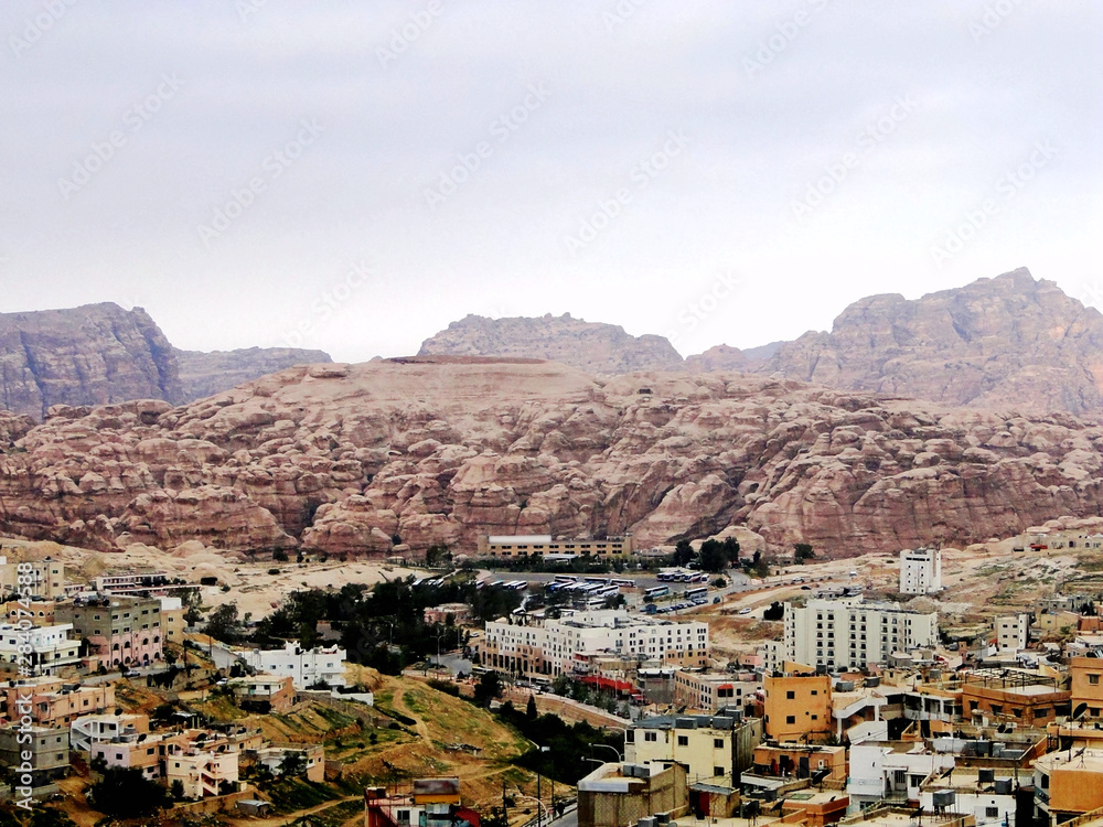 Panoramic view in Petra in Jordan, city central and UNESCO World Heritage Site, a historical archaeological park with caves, temples, and tombs reveal human civilization and Nabataean caravan-city.