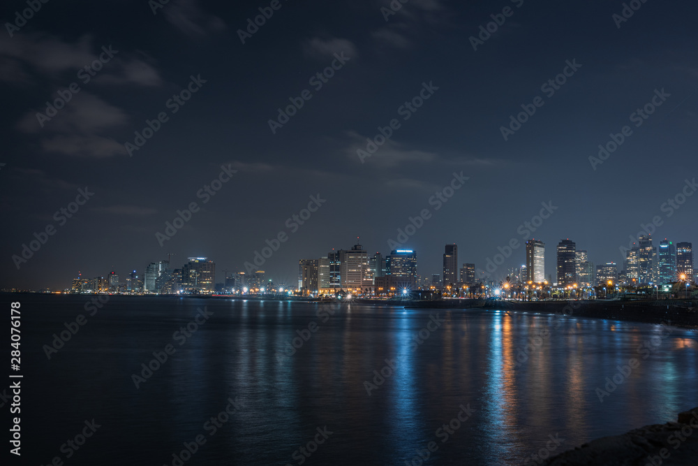 long exposure picture of tel aviv skyline from the beach