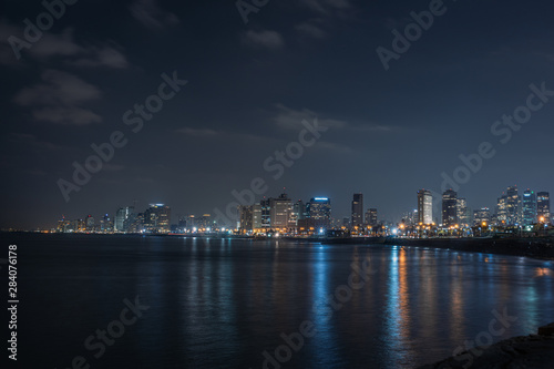 long exposure picture of tel aviv skyline from the beach