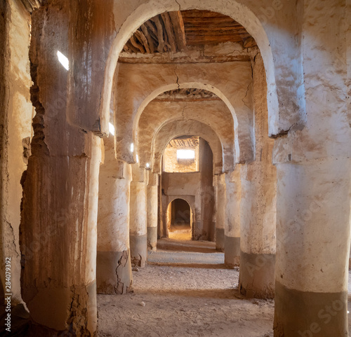 Desert town of Mhamid  Morocco village with nature sand dunes and old muslim mosque in north Africa  old narrow streets  traditional clay mud architecture