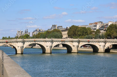 Photography bridge over the Seine river in Paris in France called PONT NEUF