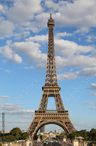High Eiffel Tower Symbol of Paris in France with some clouds in