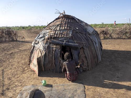 Poor huts in Dassanech village, Omo river, Ethiopia photo