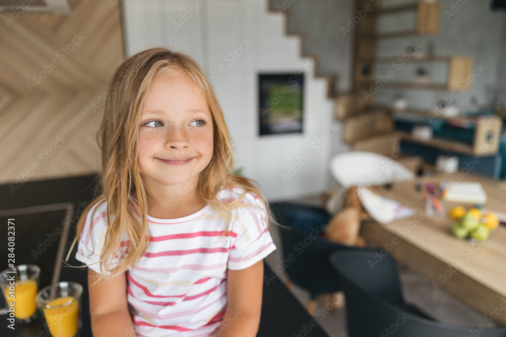 Cute girl in the house smiling stock photo Cute girl in the house smiling stock photo